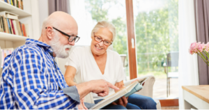 older couple looking at photo album together