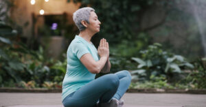 woman sitting and meditating