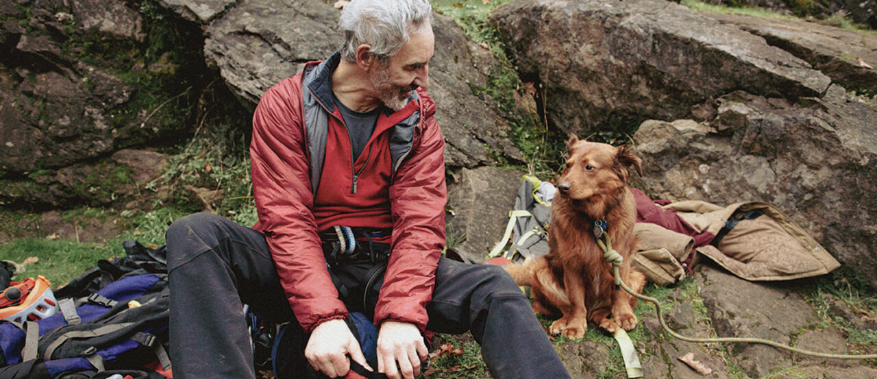 active senior on hike with dog