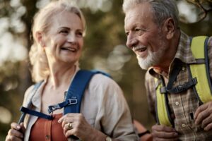 senior couple on a hike to nurture body, mind, and spirit